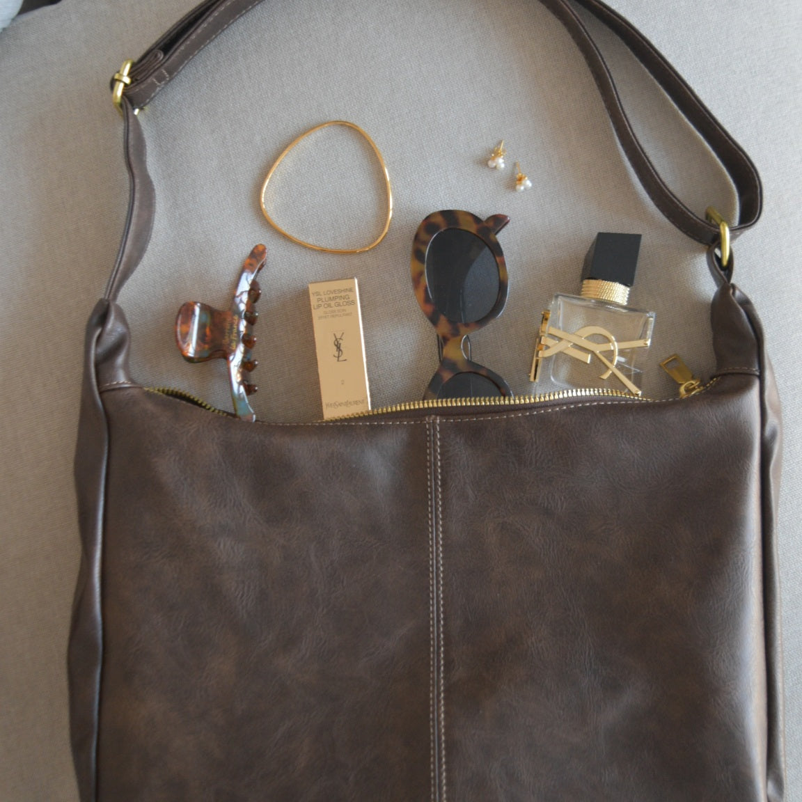 gold singature bangle and gold pearl clover earrings