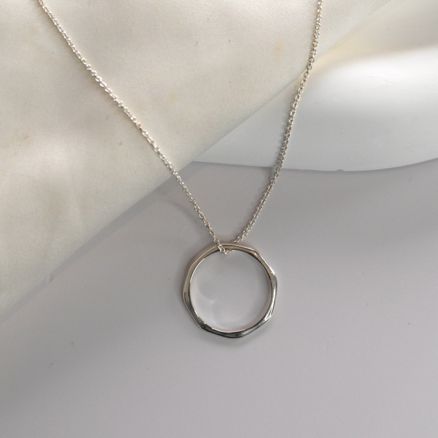 Silver angled hoop pendant