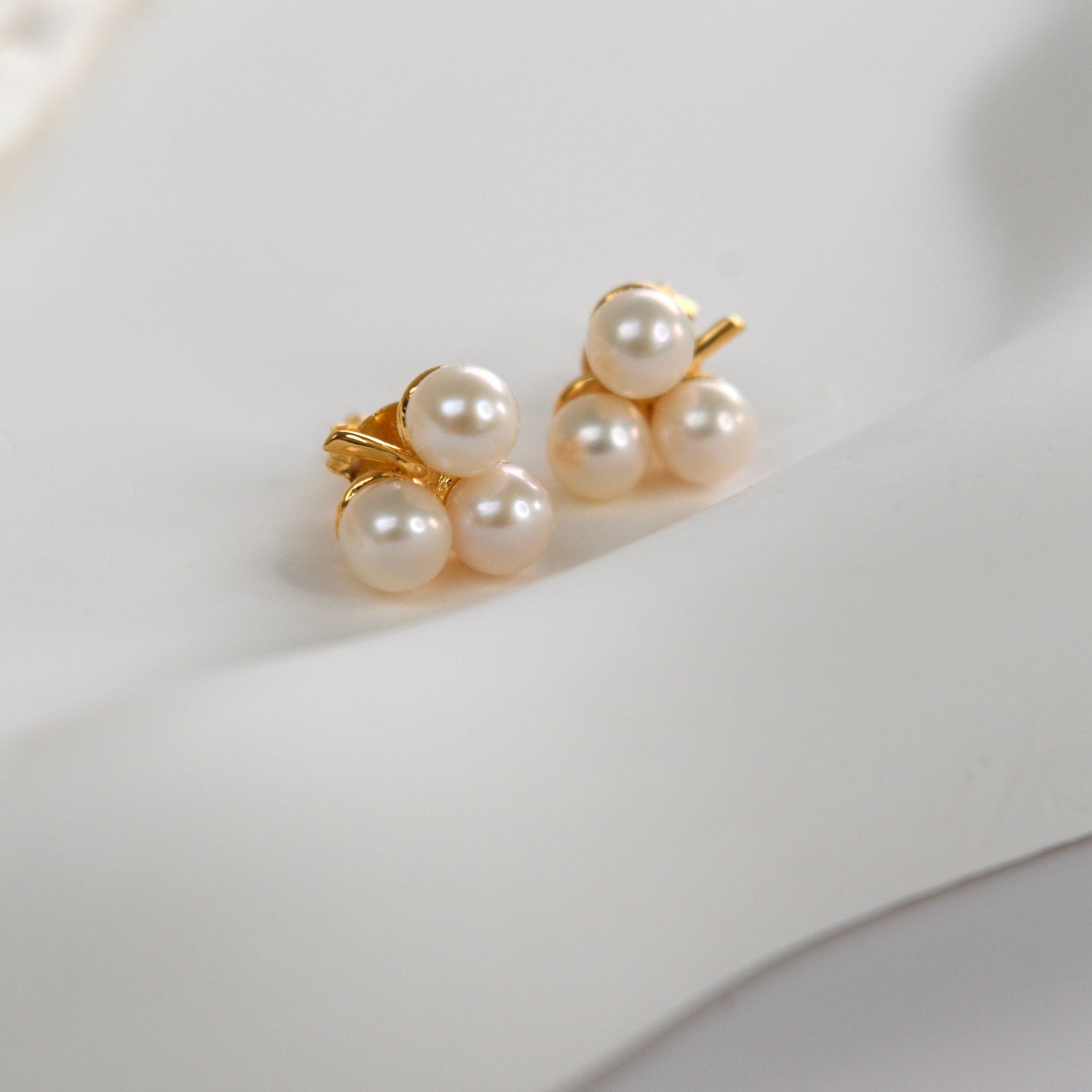 Gold clover pearl studs
