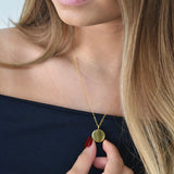 Gold disc pendant necklace