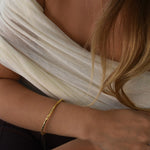 Gold hammered bangle Livetta