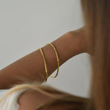 Gold vermeil signature bangle and gold vermeil hammered bangle Livetta